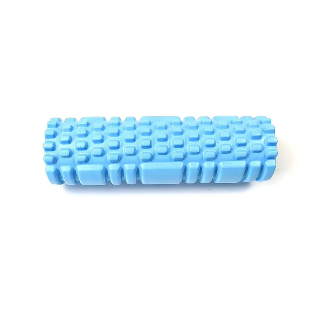 Yoga practitioner using a foam roller to enhance flexibility and muscle recovery in a serene studio setting