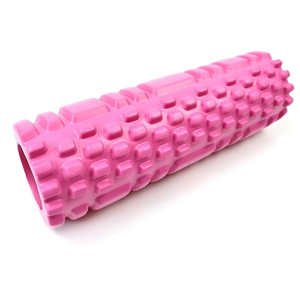 Yoga practitioner using a foam roller to enhance flexibility and muscle recovery in a serene studio setting