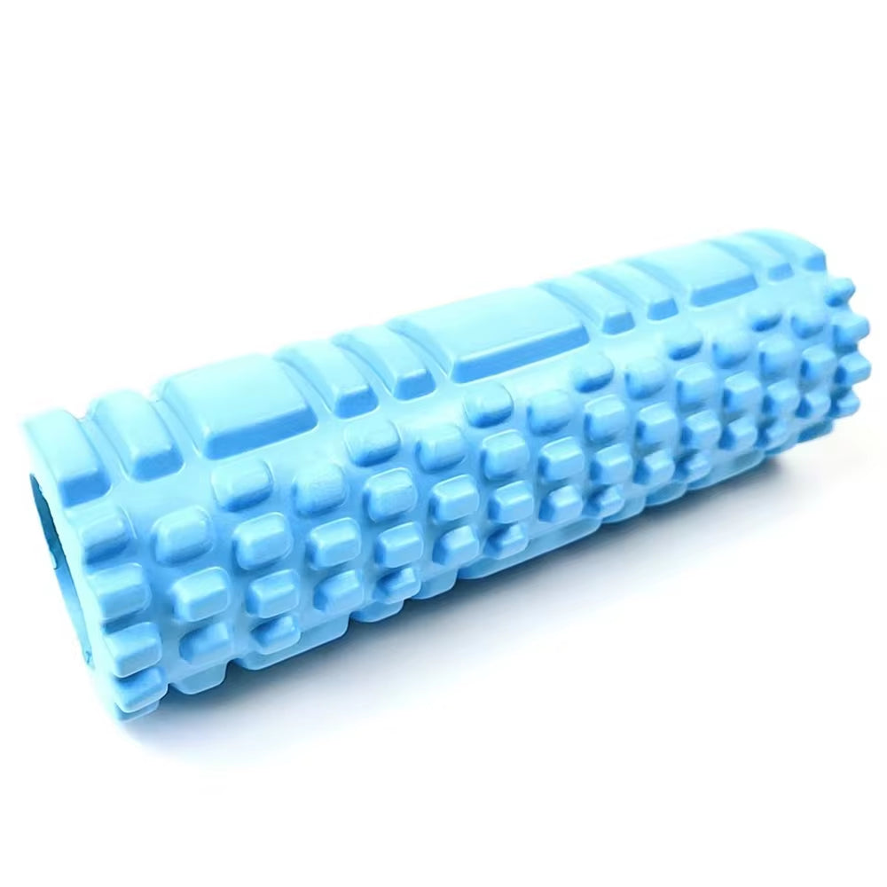 Yoga practitioner using a foam roller to enhance flexibility and muscle recovery in a serene studio setting