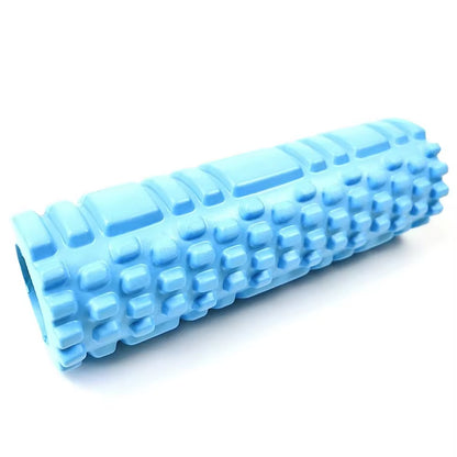 Yoga practitioner using a foam roller to enhance flexibility and muscle recovery in a serene studio setting